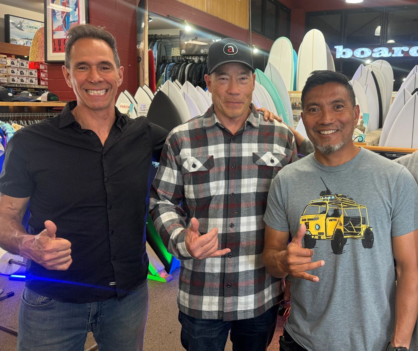 Eddie Feuer with Aaron Chang and Rick Takahashi in a surf shop