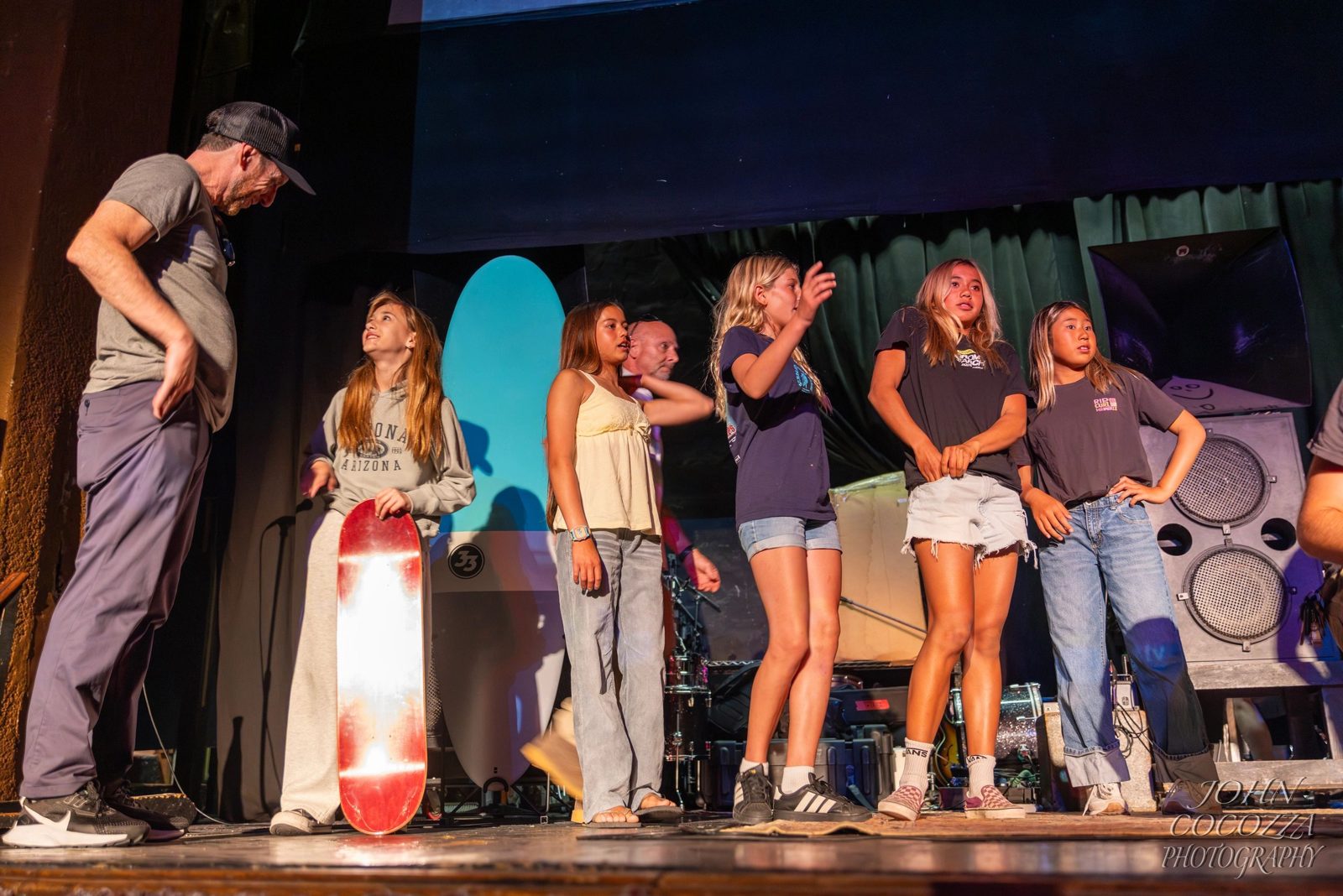 Girls on stage with Mike Doyle at the premiere